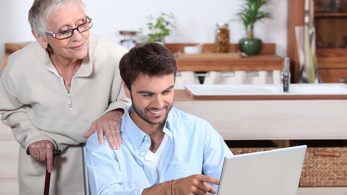 Older person and younger person talking