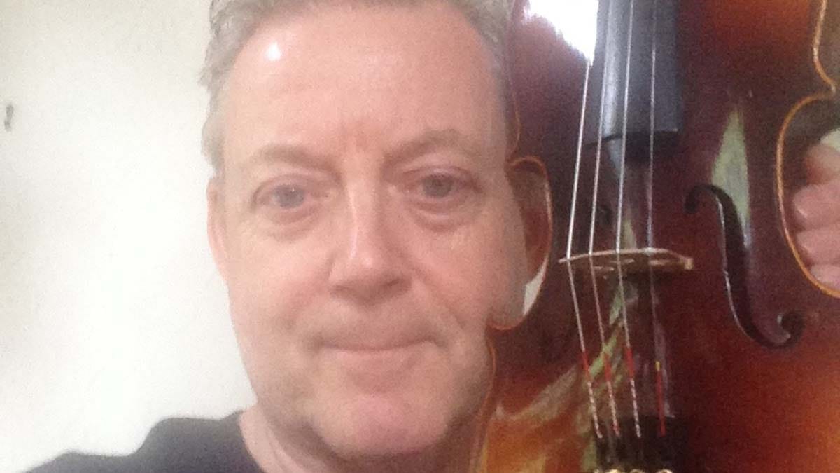 Dr Mike Sutton with Bobbie's violin