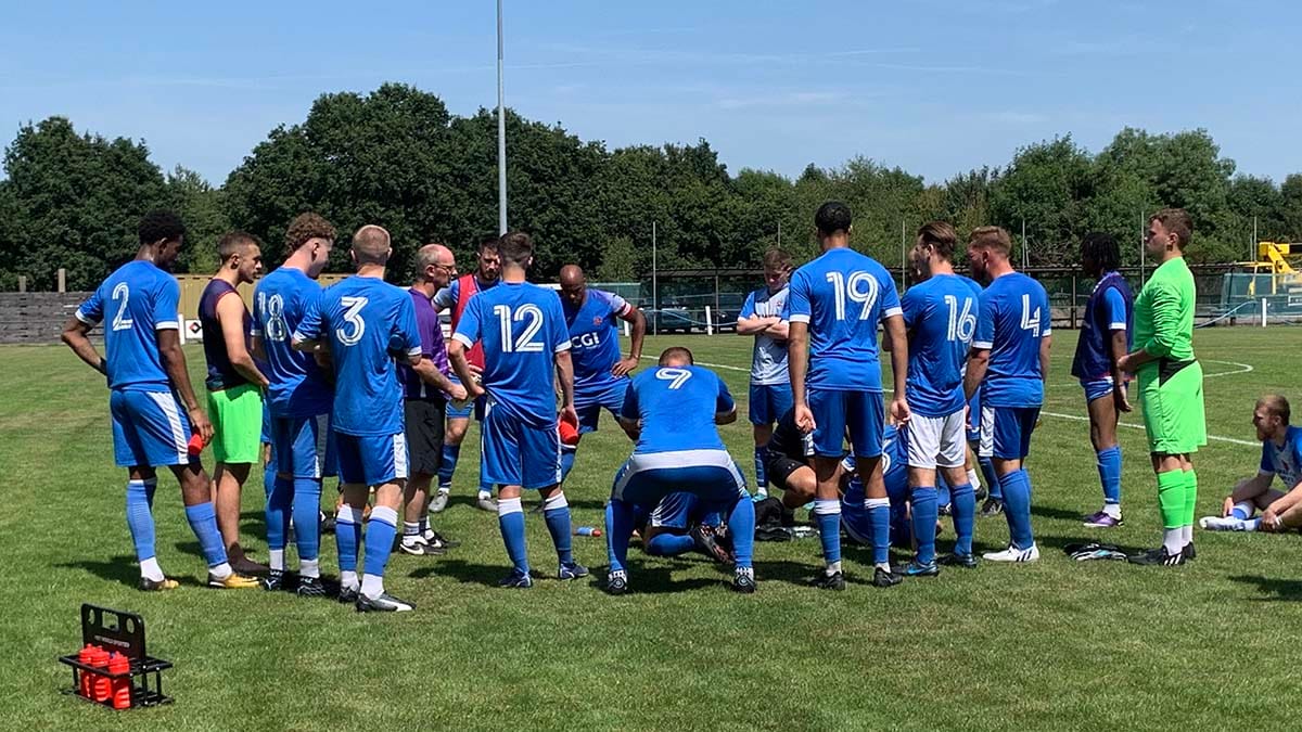 Lichfield City's players during a break in a pre-season friendly