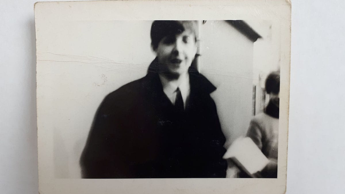 A black and white picture of Paul McCartney taken in 1963