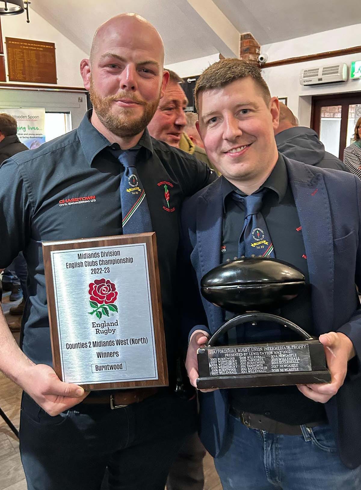 Captain Josh Canning with the league trophy and club chairman Ben Holt with the Lewis Taylor Trophy