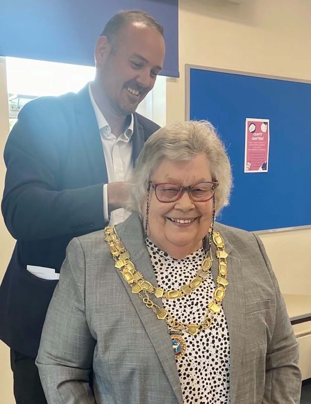 Robert Birch handing over the chains to Burntwood Town Council's new chair Cllr Di Evans