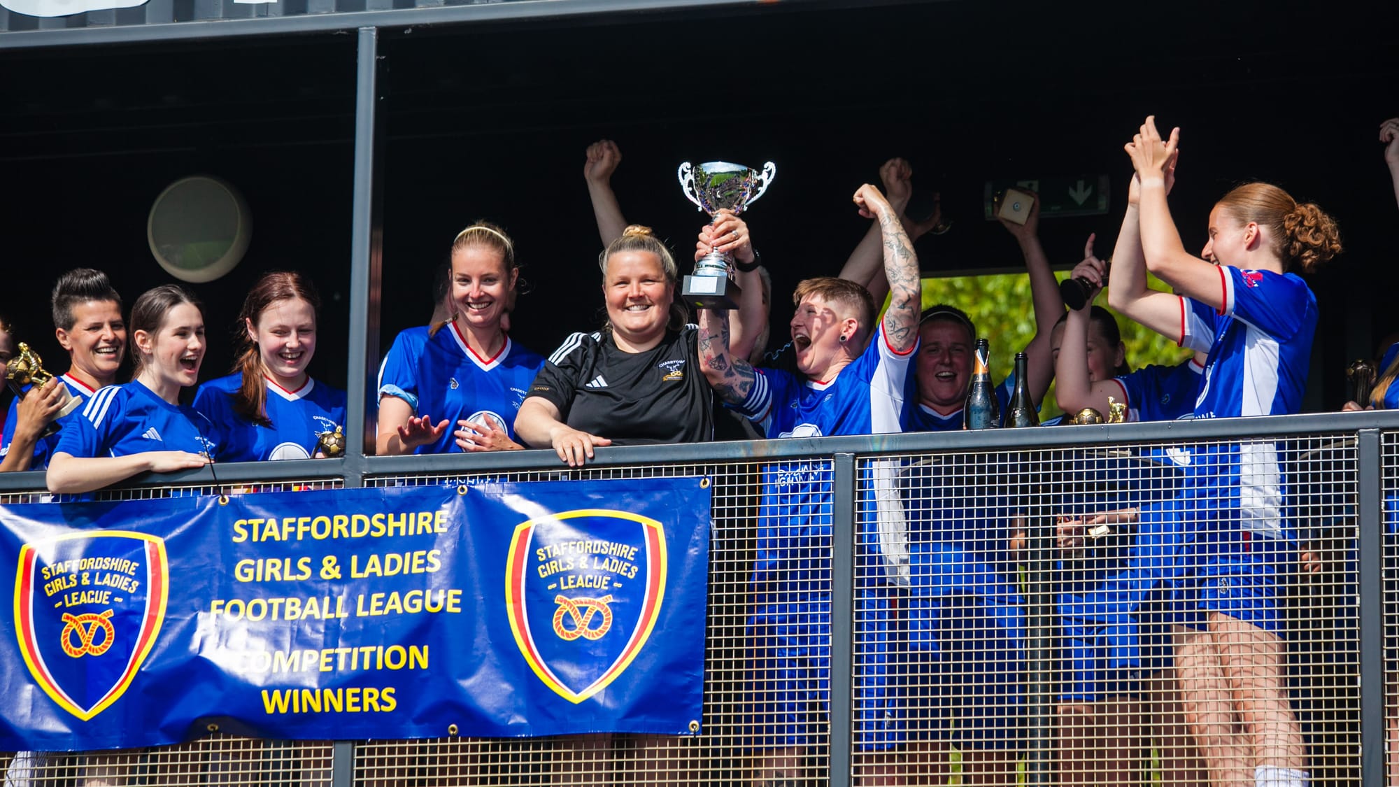 Chasetown Women manager Jo Sheerin lifts the trophy