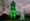 The clock tower lit up green