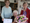 Pat Peters (centre) receiving her flowers and certificate