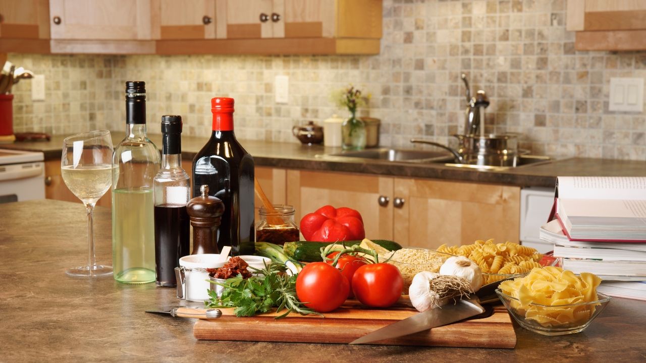 A kitchen showing ingredients on the counter used in making a Mediterranean Diet meal.