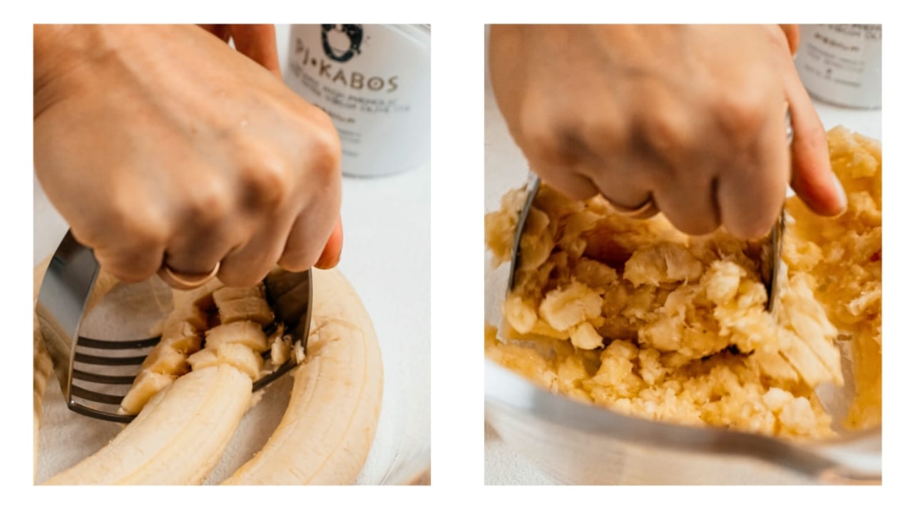 Bananas being smashed by hand to make banana bread.