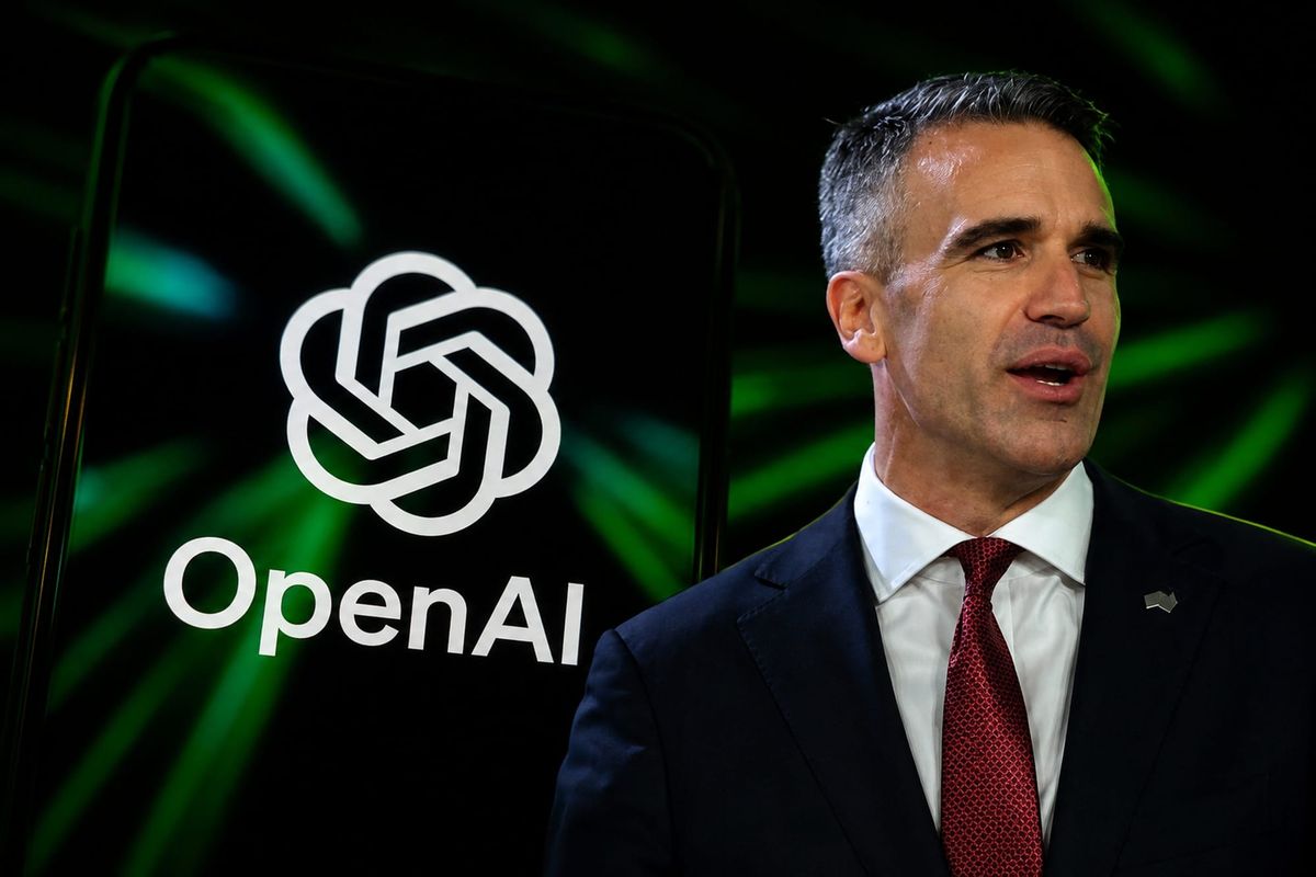 South Australian Premier Peter Malinauskas in front of a screen showing the OpenAI logo