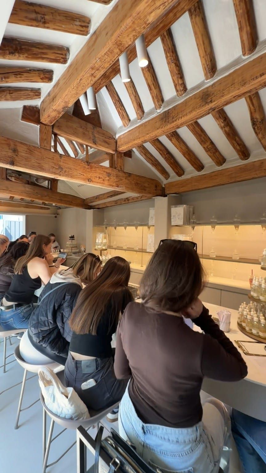 Perfume workshop tables beneath traditional wooden beams at PROUST in Hyehwa, Seoul