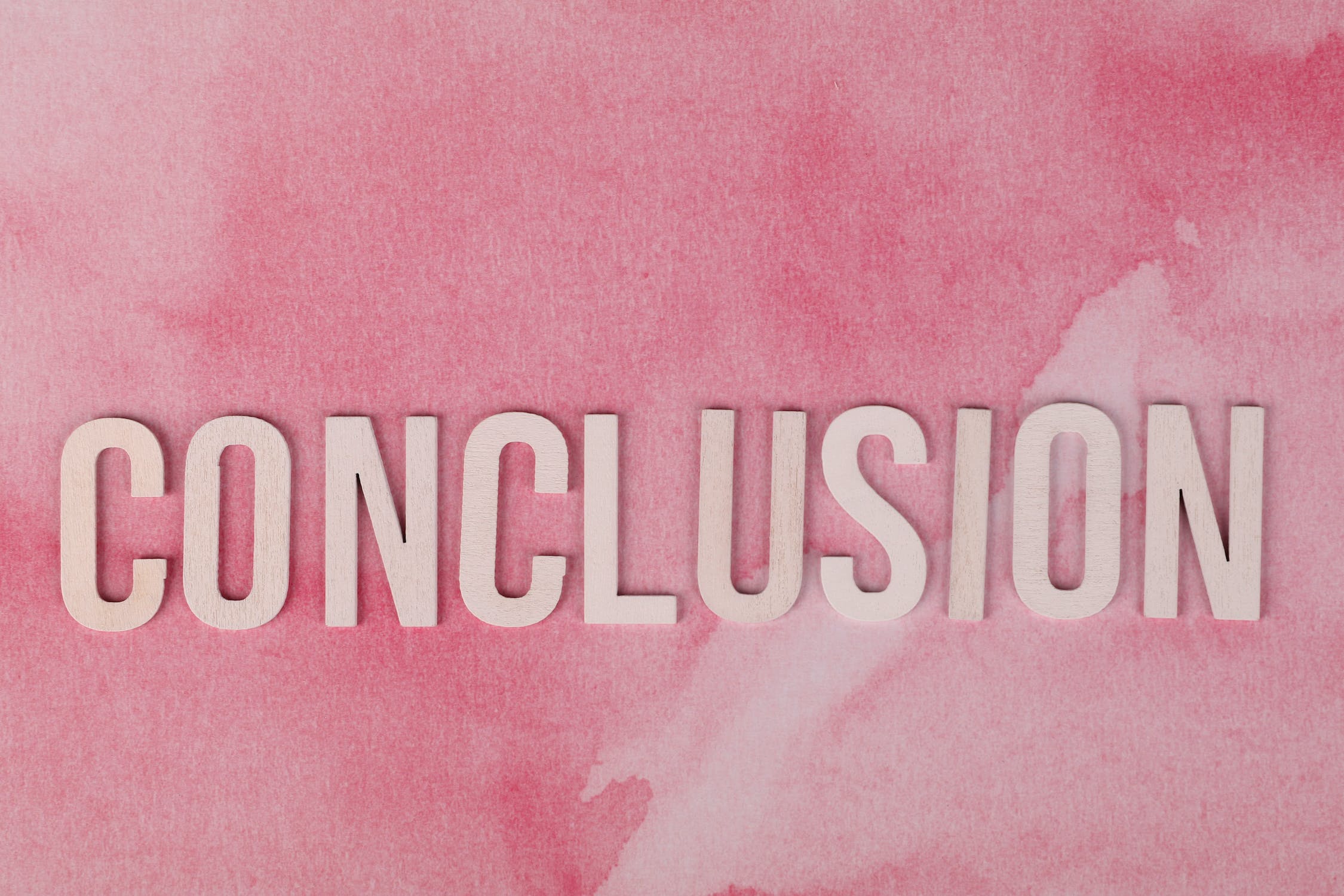 conclusion sign on pink background