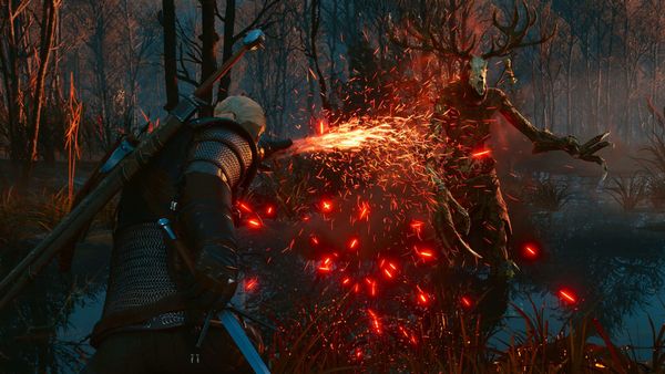 Geralt z Rivie v boji s lesním duchem, kolem nich létají jiskry