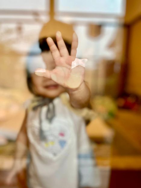 Hand on glass