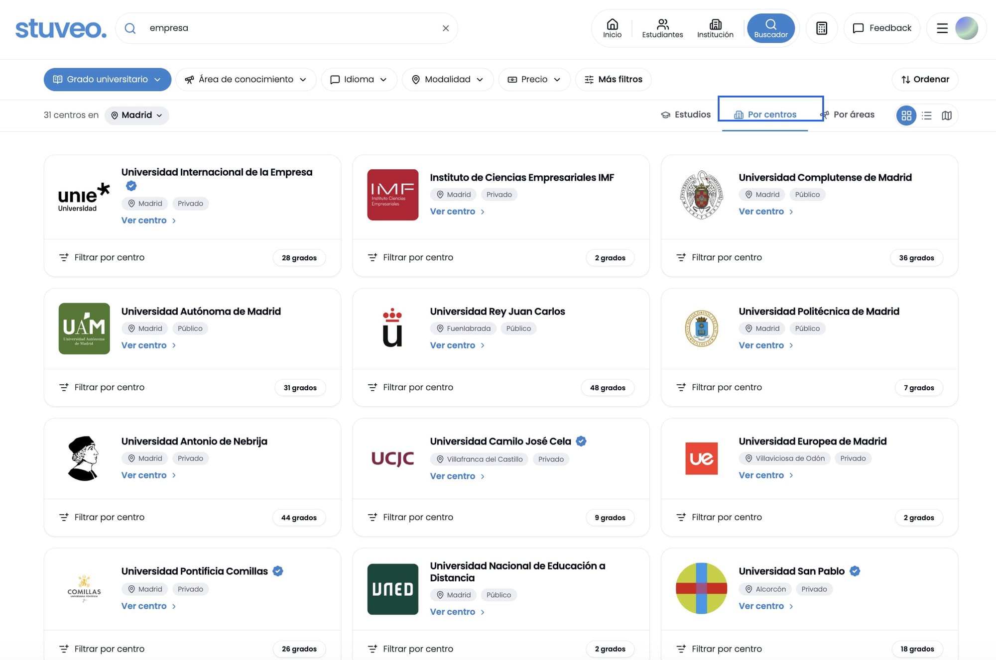 Pestaña Por centros marcada, con el listado de centros que ofrecen estudios de empresa en Madrid