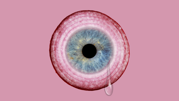 An onion ring with a human eye inlaid at the centre, a solitary tear drop falling from it