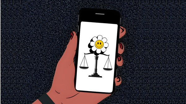 Hand holding a smartphone, the screen showing a balanced scale of justice and a smiling flower