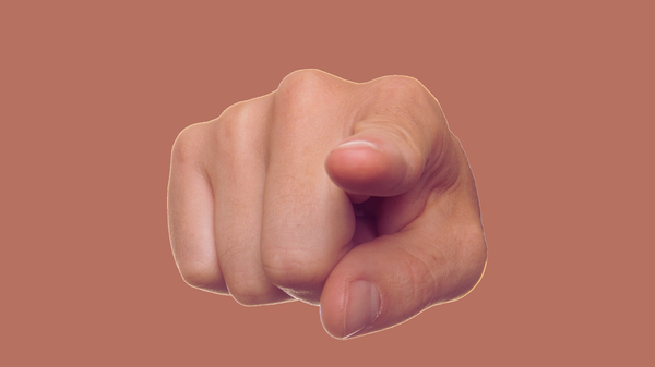 A hand with the index finger pointing straight at the reader