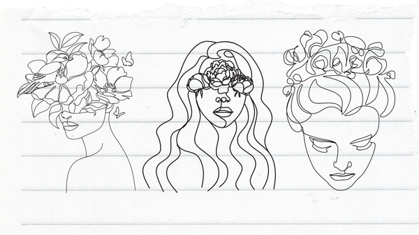 Illustrations of human heads with floral patterns on a ruled sheet of paper