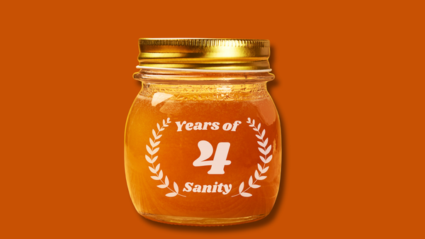 Against a burnt orange background, a jar of orange jam with '4 years of Sanity' inscribed on it