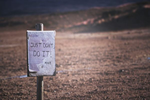 A signboard on a beach that reads: "Just don't do it - Mike", a spoof of Nike's "Just do it" campaign