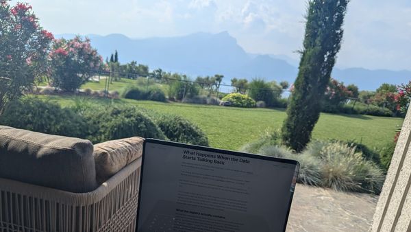 Laptop showing Heart Rhythm International article on a terrace overlooking Lake Garda, Italy