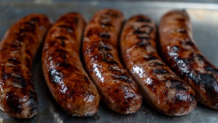 Beer Braised and Grilled Brats with Onions