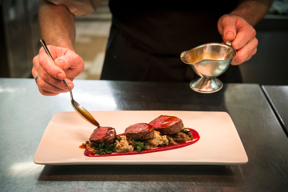 Plating up steak at the Ubiquitous Chip restaurant