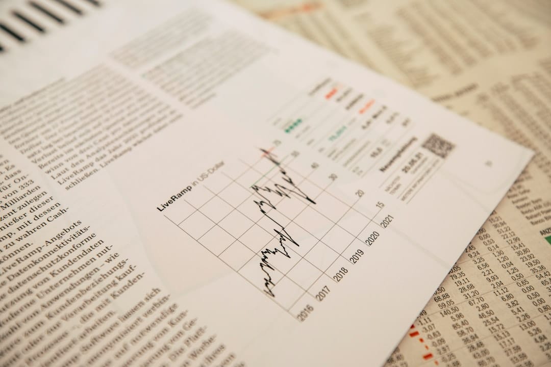 financial newspaper with stock chart