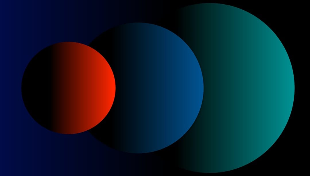 three circles of different colors on a black background