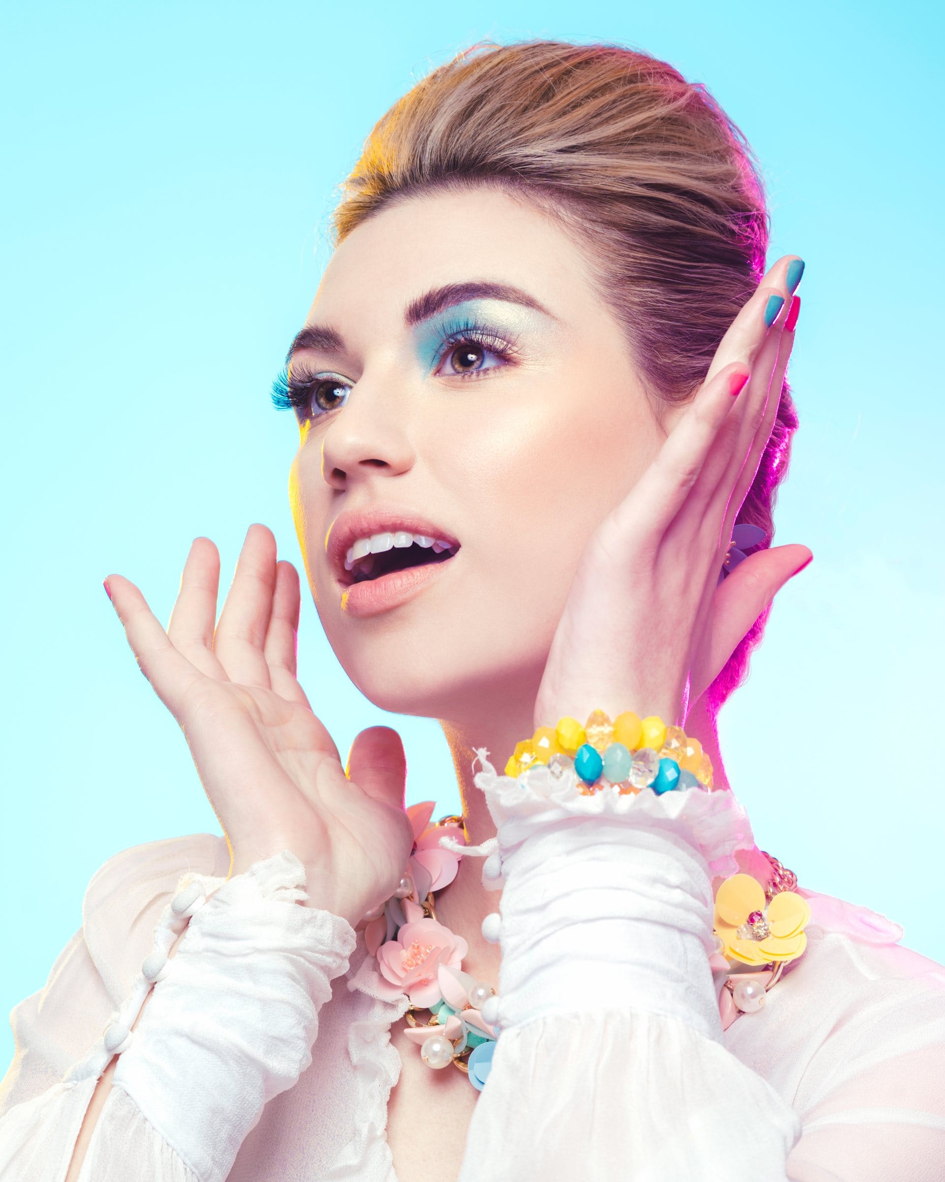 Bright pastel beauty portrait with turquoise eyeshadow