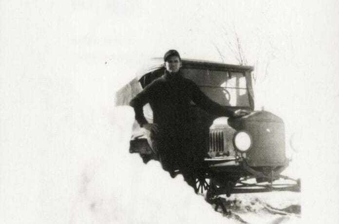 'Early rural mail carrier adding skis to the mail truck in Washington County, Wisconsin'