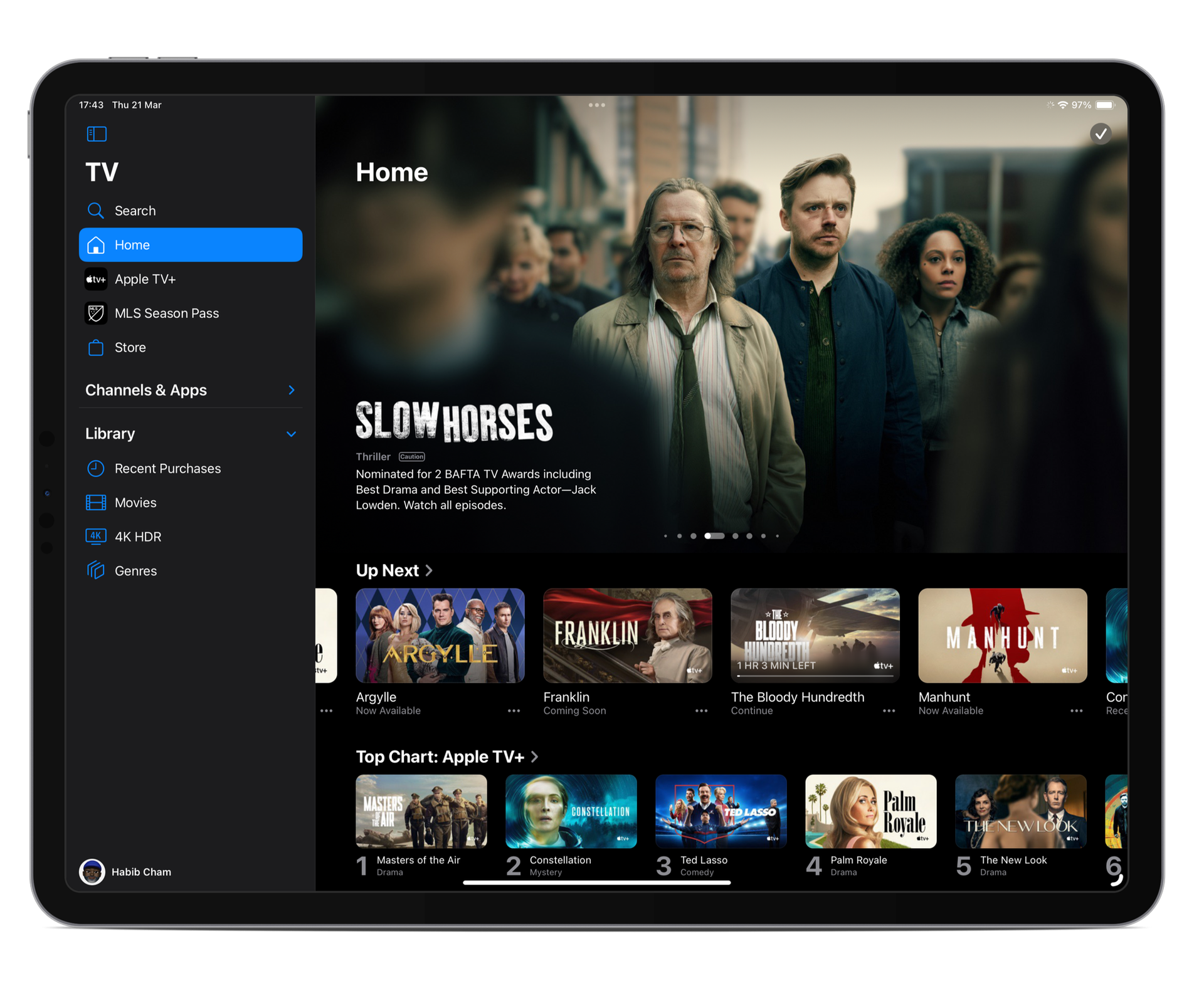 iPad displaying the Apple TV Plus interface highlighted by a featured banner for a show called "Slow Horses."