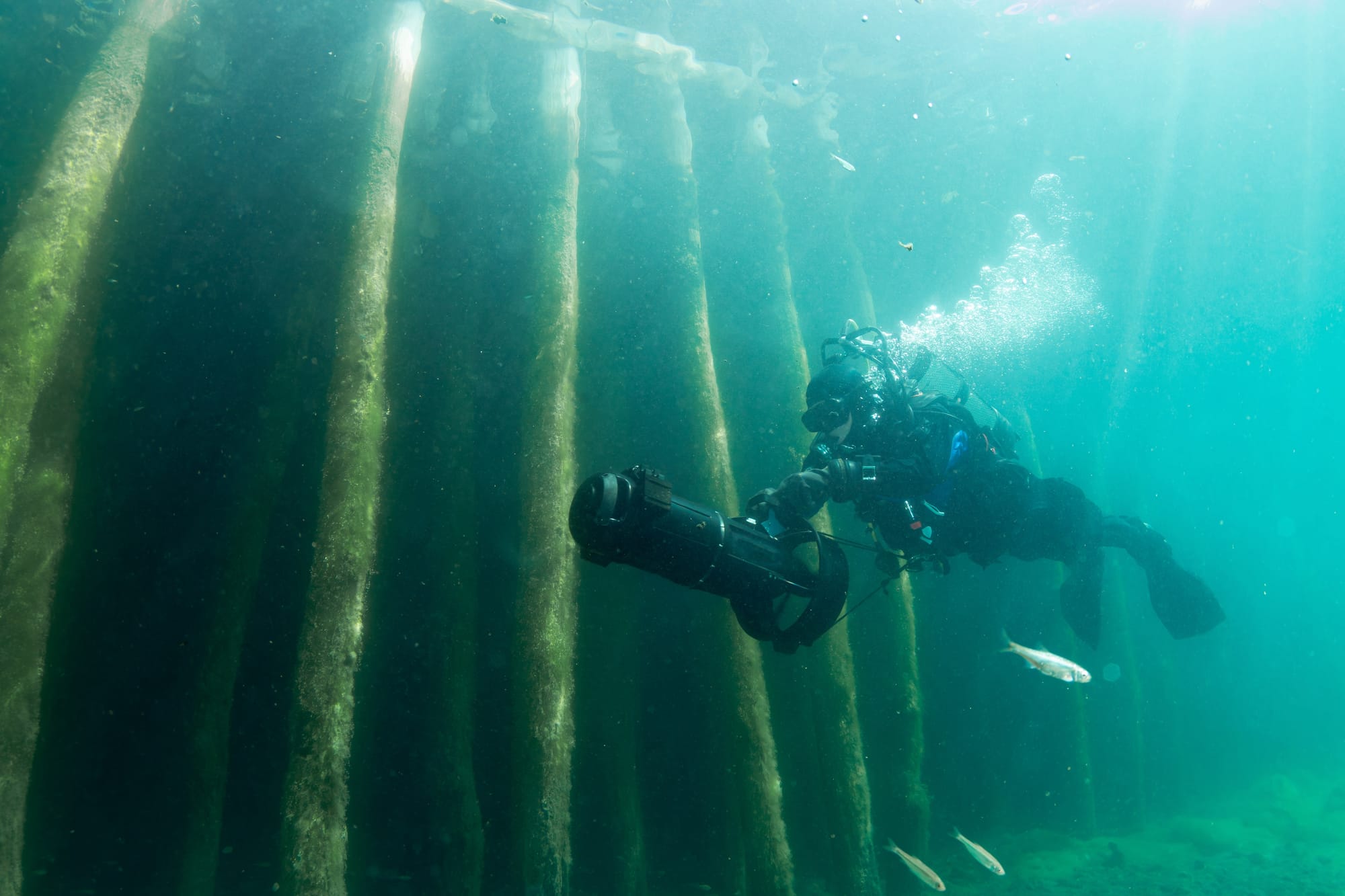 Scuba diver using a DPV (diver propulsion vehile) or underwater scooter
