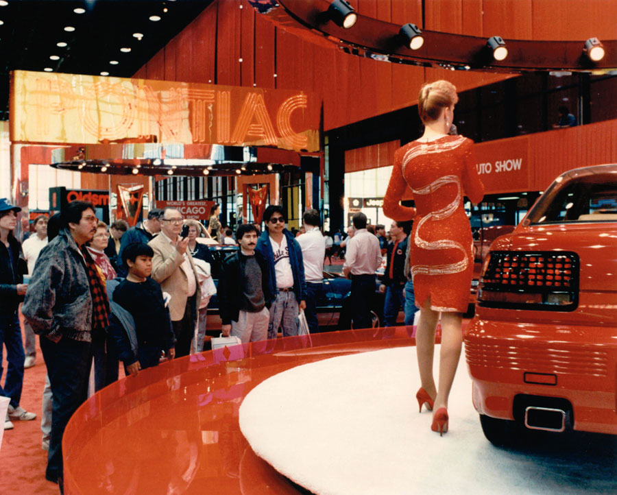 Product specialist discussing a 1989 Pontiac Grand Prix at the 1989 Chicago Auto Show