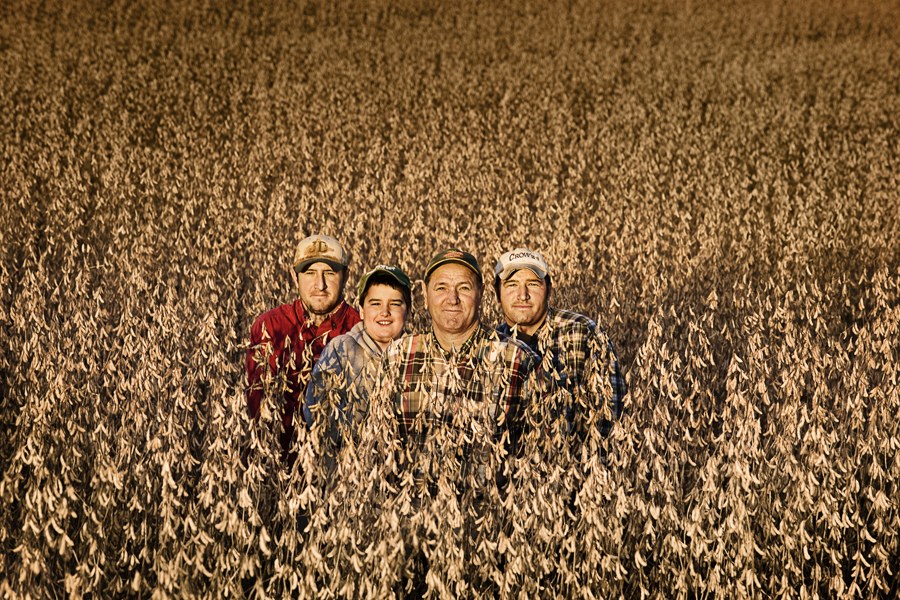 PAT HARDY with his sons, BRETT and BRAD, and grandson, JACOB, soybeans, Grant City, Missouri<br /><br />
“We started kind of a tradition after my oldest son got married. Every Sunday after church the three boys and their families come over for a meal. I get to just sit there and listen to them talking about whatever’s going on—I don’t have to say anything—and it makes me feel good to see how close they are and know that when I’m gone they’ll take care of each other. And those boys enjoy it as much as I do—I get a big kick out of that, too. I think it just started off with some fried chicken and it went from there.”
