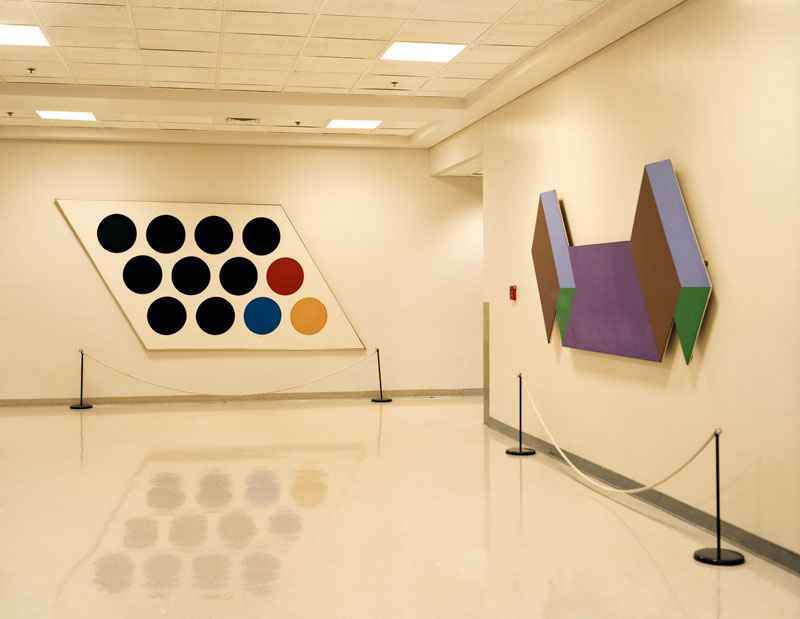 The Central Intelligence Agency, Art<br>
CIA Original Headquarters Building, Langley, Va.<br /><br />
The Fine Arts Commission of the CIA is responsible for acquiring art to display in the Agency’s buildings. Among the commission’s curated art are two pieces (pictured) by Thomas Downing, on long-term loan from the Vincent Melzac collection. Downing was a member of the Washington Color School, a group of post World War II painters whose influence helped to establish the city as a center for arts and culture. Vincent Melzac was a private collector of abstract art and the Administrative Director of the Corcoran Gallery of Art, Washington, D.C.’s, premiere art museum.<br /><br />
Since the founding of the CIA in 1947, the Agency has participated in both covert and public cultural diplomacy efforts throughout the world. It is speculated that some of the CIA’s involvement in the arts was designed to counter Soviet Communism by helping to popularize what it considered pro-American thought and aesthetic sensibilities. Such involvement has raised historical questions about certain art forms or styles that may have elicited the interest of the Agency, including abstract expressionism.