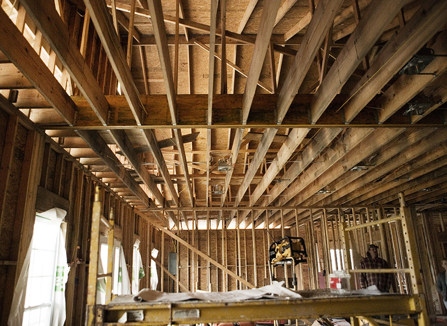 Especially with just the frame up, the house’s height and the open living area give the impression of a gymnasium or warehouse. “It won’t look this big once it’s got walls,” the owner explains. “I found this lumber—it’s called enforced lumber. It’s actually a plywood.” I ask him how strong it is. “You could park a truck up there,” he says.<br /><br />
Ten feet of water covered the previous home on this lot after Katrina. When the homeowner came to look at the house in early 2006, he says he was disgusted. “I just called some people over with trucks and I told ‘em to haul it all out. I didn’t want to deal with the mess and this way it’s high enough now it’ll be OK.” We all smile, relieved. “Tornado could come here and do some damage, but a hurricane, nah, this house isn’t going anywhere.”