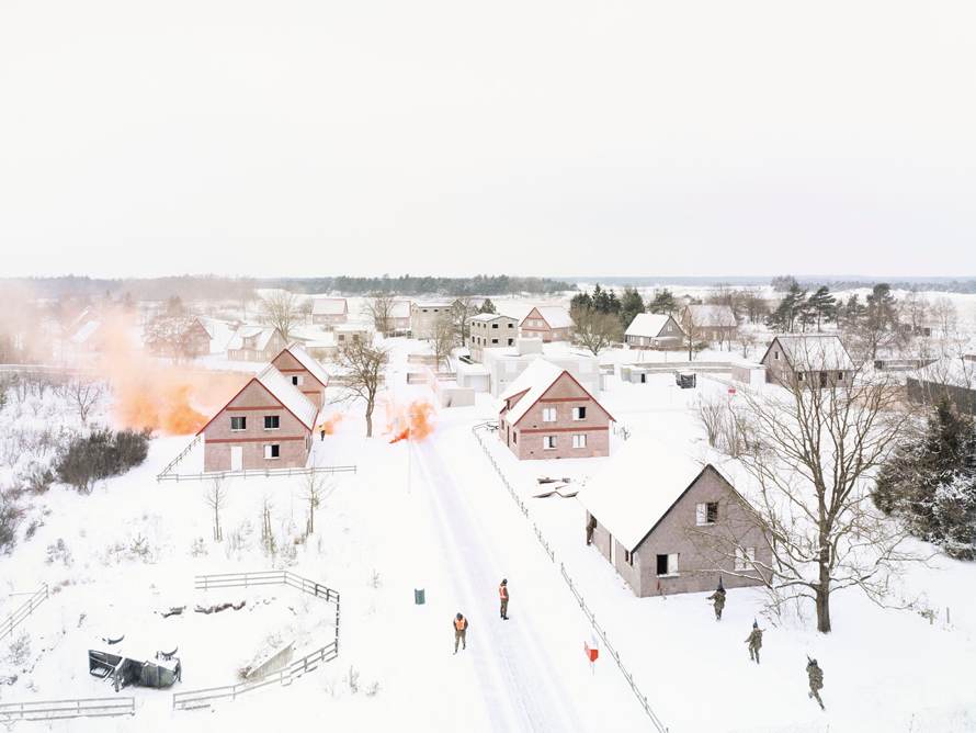 Royal Dutch Army No.10 Oostdorp Harskamp—Gelderland, Feb. 10, 2011. C company of the 13th Infantry of the Air Cavalry Brigade during Urban Operations Training. The smoke provides cover for their movement.