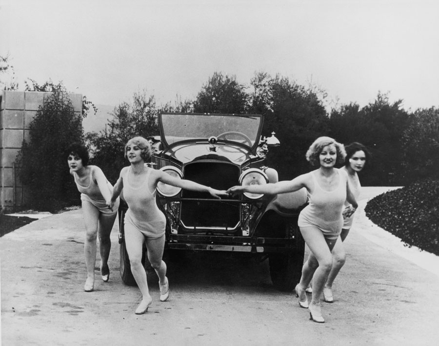 Packard Motor Co. enlisted members of the Marion Morgan Dancers to promote the 1927 model Packard 343 Series Eight. The troupe danced around the United States at auto events and in London in variety shows, specializing in interpretative Greek movement. Here, dancers perform a circle ceremony around a convertible coupe.