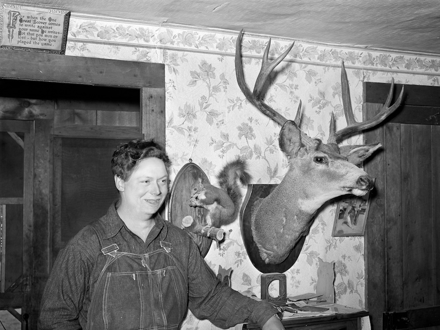 Mildred Anthony, standing by mounted animals which she killed, 2010
10 1/2 x 14