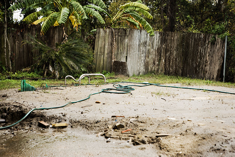 Prior to the rebuild, the owner filled the pool in herself after a tragic accident—you can see the top of the ladder sticking out—but the ground in the backyard still needs to be leveled.