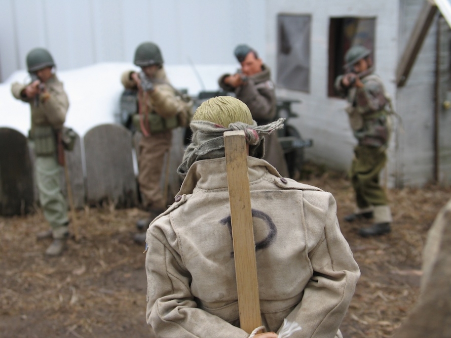 A Nazi spy posing as an American is executed by an Allied firing squad.
Photo by Mark E. Hogancamp. Courtesy of The Cinema Guild.