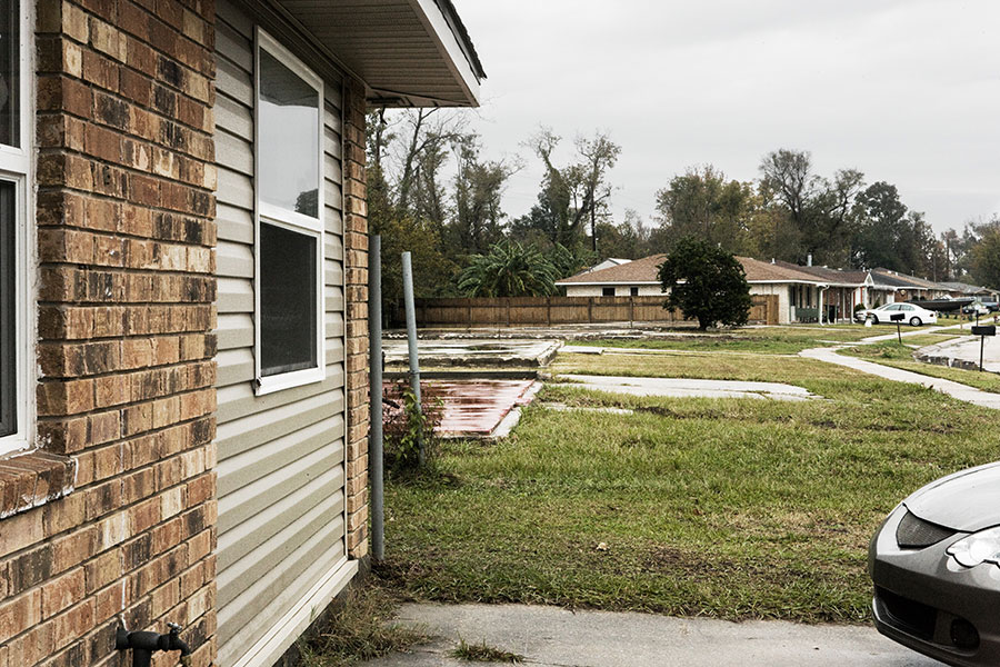 When rebuilding, many homeowners turned attached garages into additional rooms. The red slab next to the house is a former neighbor’s foundation. “A lot of kids were getting sick after playing on the foundations,” Justine tells me. “They found out that the tile had been holding in a lot of waste and toxic material from the storm and it was leeching out.” Now they paint the slabs with a chemical to keep them from leeching—that’s why they’re red.<br /><br />
On Jan. 12, The St. Bernard Parish Housing, Redevelopment, and Quality of Life Commission announced that it will remove slabs from the nearly 4,000 homes sold to Louisiana’s Road Home program after the storm. “<a href=