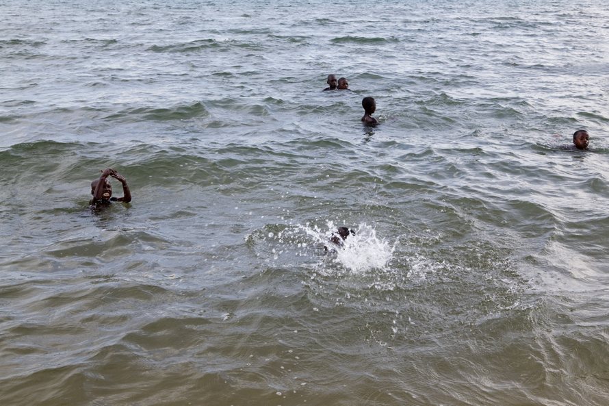 Children playing in the water on a typical Sunday afternoon at Lake Tanganyika. 