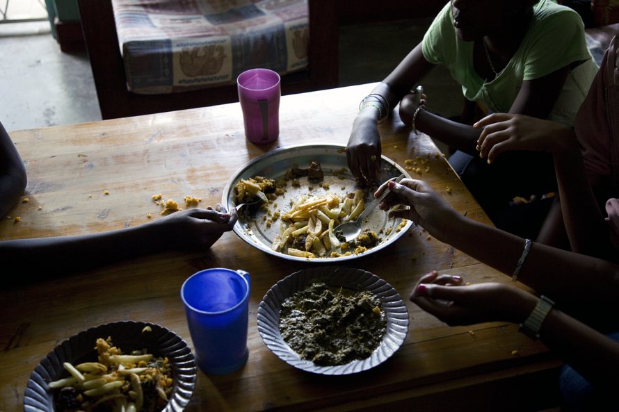 Koky’s daughters eating a typical evening meal. 