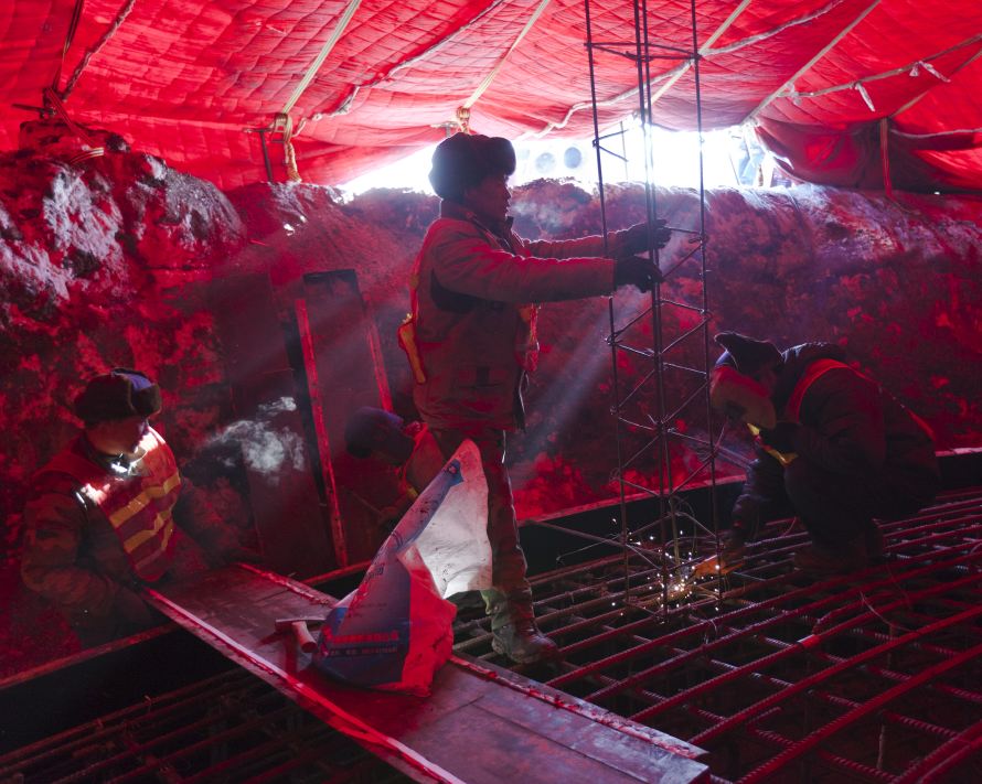 Xi'an, Nov. 17, 2010: A wind farm in Inner Mongolia braves the harsh -20°C winters. The project is being expanded rapidly in phases of 33 megawatts or more to avoid the bureaucratic process of national planning. The concrete foundation for the tower must be insulated and kept above 10°C during curing to prevent cracking. (Photo by Toby Smith. Reportage by Getty Images.)