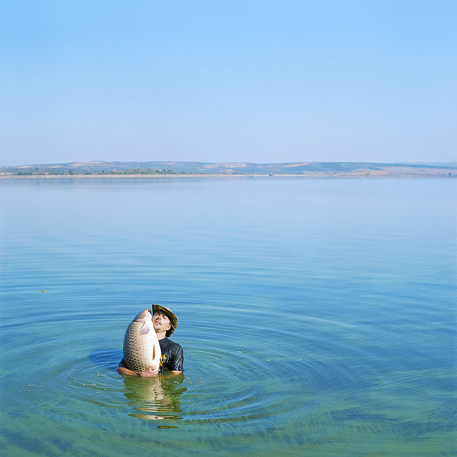 © Evžen Sobek, <em>Untitled (Man With Fish in Water)</em>, 2009. Courtesy of ClampArt, New York City.