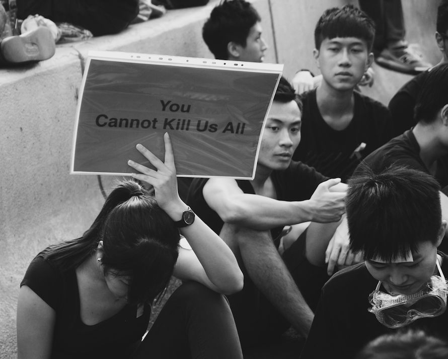 Students, fatigued and sweaty, stay composed and bleakly optimistic inside one of the Occupation sites in Admiralty.