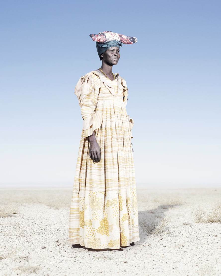 “Herero Woman in Yellow Dress” (2012) © Jim Naughten, Image courtesy of Klompching Gallery, New York City
