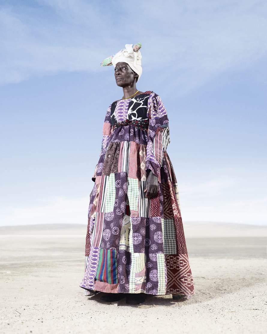 “Herero Woman in Patchwork Dress 2” (2012) © Jim Naughten, Image courtesy of Klompching Gallery, New York City