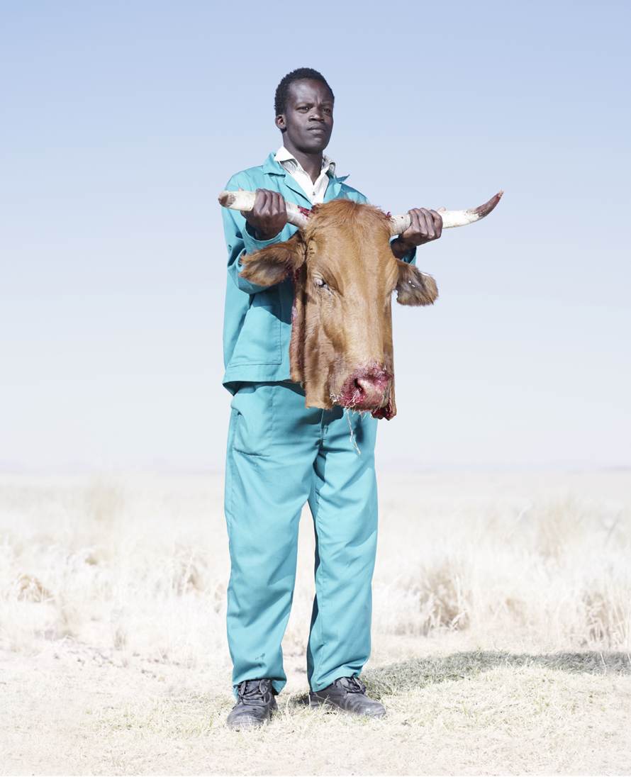 “Herero Man with Cow’s Head” (2012) © Jim Naughten, Image courtesy of Klompching Gallery, New York City